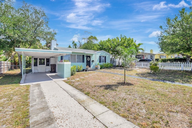 953 Churchill Rd, West Palm Beach, FL 33405 - view of front of property featuring concrete driveway and a chimney