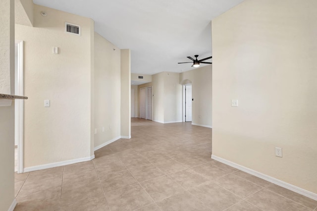 11039 Legacy Blvd Unit 203, Palm Beach Gardens, FL 33410 - spare room with visible vents, baseboards, ceiling fan, and light tile patterned floors