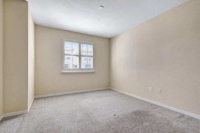 11039 Legacy Blvd Unit 203, Palm Beach Gardens, FL 33410 - carpeted spare room with a textured ceiling and baseboards