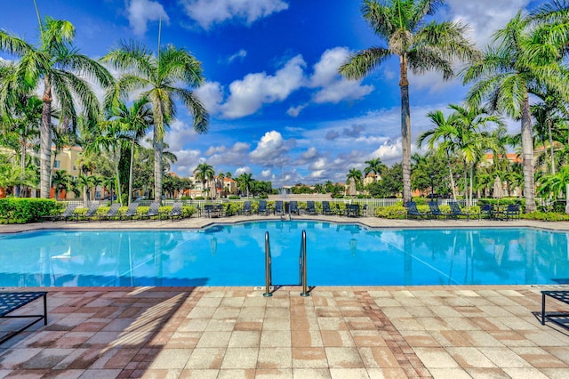 11039 Legacy Blvd Unit 203, Palm Beach Gardens, FL 33410 - pool featuring a patio area and fence