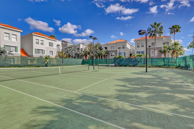 11039 Legacy Blvd Unit 203, Palm Beach Gardens, FL 33410 - view of tennis court featuring fence and a residential view