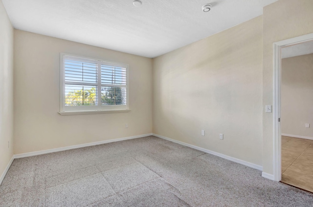 11039 Legacy Blvd Unit 203, Palm Beach Gardens, FL 33410 - carpeted empty room with baseboards