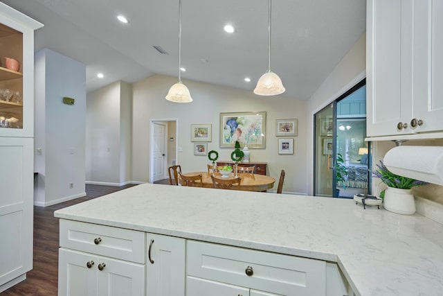 527 10th Ct, Vero Beach, FL 32962 - kitchen featuring white cabinetry, light stone countertops, dark wood-style floors, decorative light fixtures, and recessed lighting