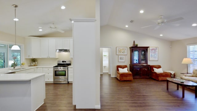 527 10th Ct, Vero Beach, FL 32962 - kitchen with stainless steel gas range, ceiling fan, a sink, open floor plan, and under cabinet range hood