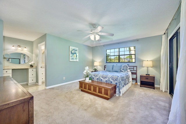 527 10th Ct, Vero Beach, FL 32962 - bedroom with light carpet, baseboards, a ceiling fan, and a textured ceiling
