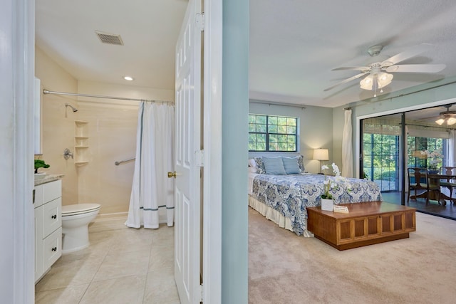 527 10th Ct, Vero Beach, FL 32962 - bedroom featuring ensuite bathroom, light tile patterned flooring, access to exterior, recessed lighting, and a ceiling fan
