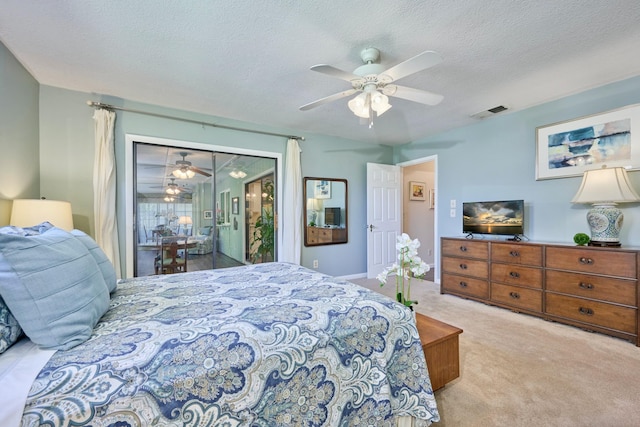 527 10th Ct, Vero Beach, FL 32962 - carpeted bedroom featuring access to exterior, a textured ceiling, and ceiling fan