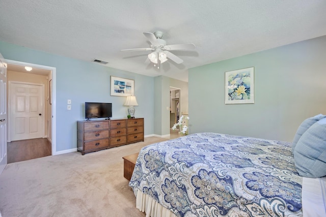 527 10th Ct, Vero Beach, FL 32962 - bedroom featuring carpet, ceiling fan, baseboards, and a textured ceiling