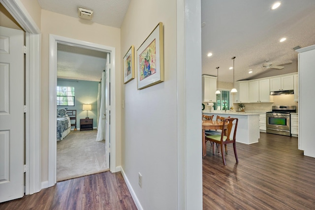 527 10th Ct, Vero Beach, FL 32962 - hall featuring dark wood-type flooring, recessed lighting, baseboards, and a textured ceiling