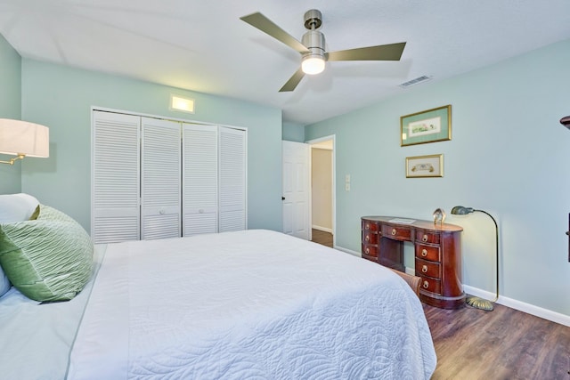 527 10th Ct, Vero Beach, FL 32962 - bedroom featuring wood finished floors, baseboards, a closet, and ceiling fan
