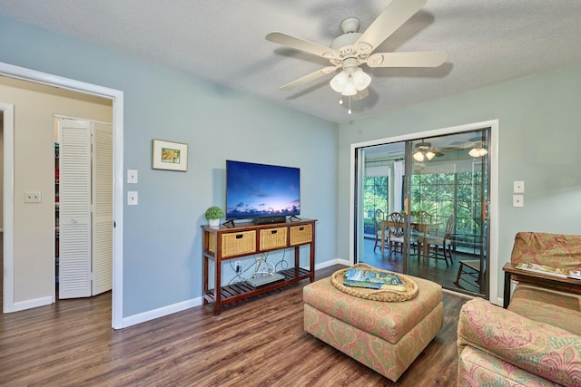 527 10th Ct, Vero Beach, FL 32962 - living area with ceiling fan, wood finished floors, baseboards, and a textured ceiling