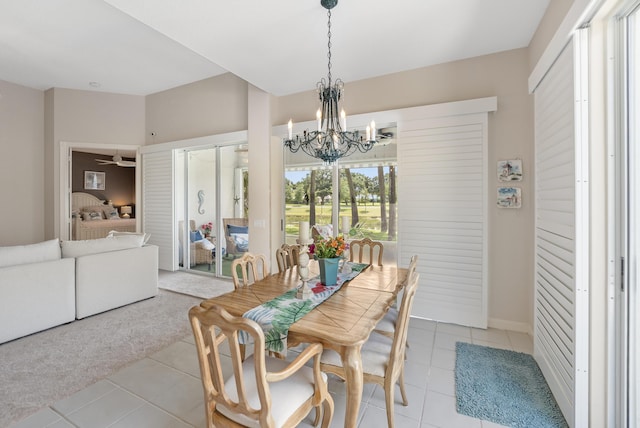 8483 Beaconhill Rd, Palm Beach Gardens, FL 33410 - dining room featuring a chandelier and light tile patterned floors