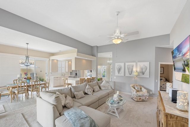 8483 Beaconhill Rd, Palm Beach Gardens, FL 33410 - living area with a chandelier, ceiling fan, and light carpet