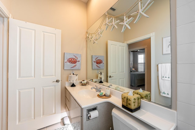 8483 Beaconhill Rd, Palm Beach Gardens, FL 33410 - bathroom with vanity and toilet