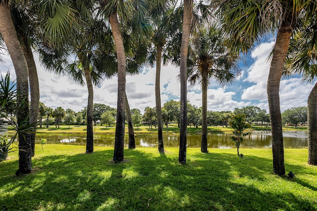8483 Beaconhill Rd, Palm Beach Gardens, FL 33410 - view of grassy yard with a water view