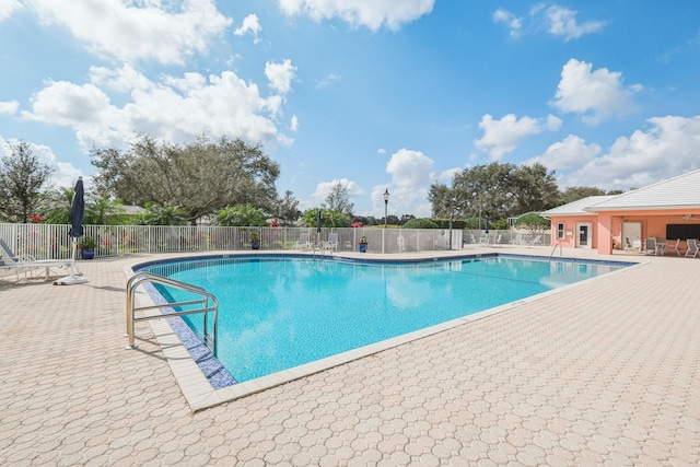 8483 Beaconhill Rd, Palm Beach Gardens, FL 33410 - community pool with fence and a patio