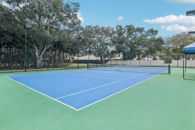 8483 Beaconhill Rd, Palm Beach Gardens, FL 33410 - view of tennis court featuring fence
