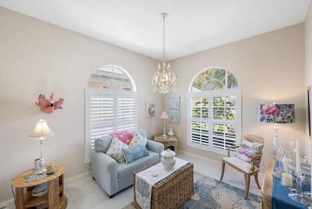 8483 Beaconhill Rd, Palm Beach Gardens, FL 33410 - sitting room with a chandelier, baseboards, and tile patterned flooring