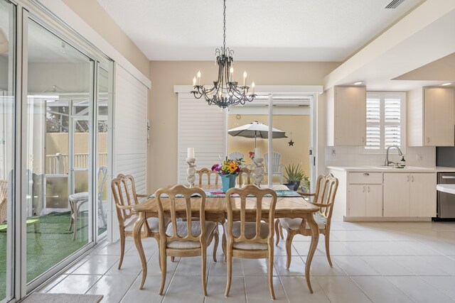 8483 Beaconhill Rd, Palm Beach Gardens, FL 33410 - dining room with a chandelier and light tile patterned flooring