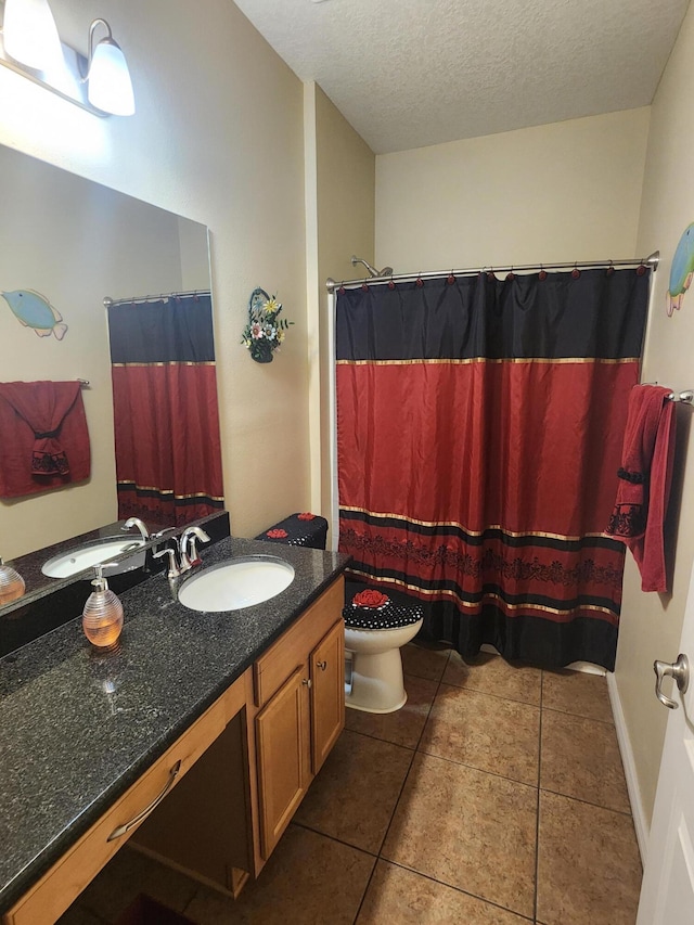 1691 SW Buttercup Ave, Port Saint Lucie, FL 34953 - bathroom featuring vanity, a textured ceiling, tile patterned floors, and toilet