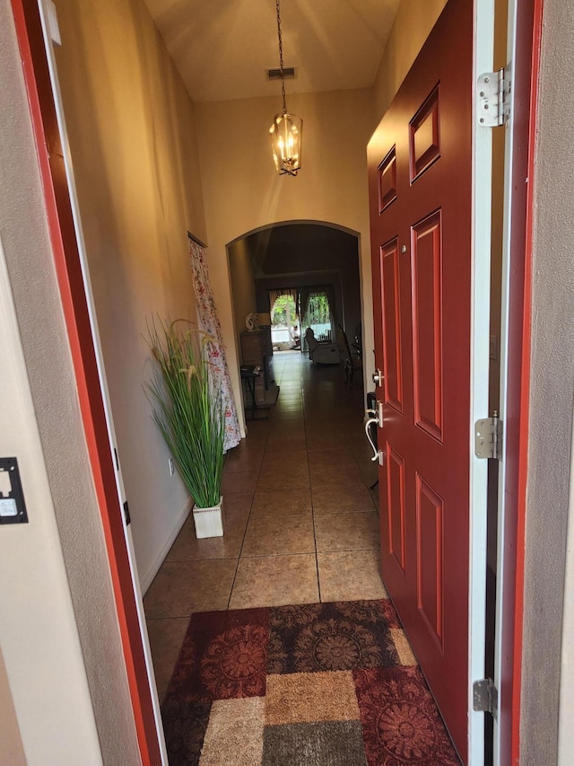 1691 SW Buttercup Ave, Port Saint Lucie, FL 34953 - tiled foyer featuring visible vents and arched walkways
