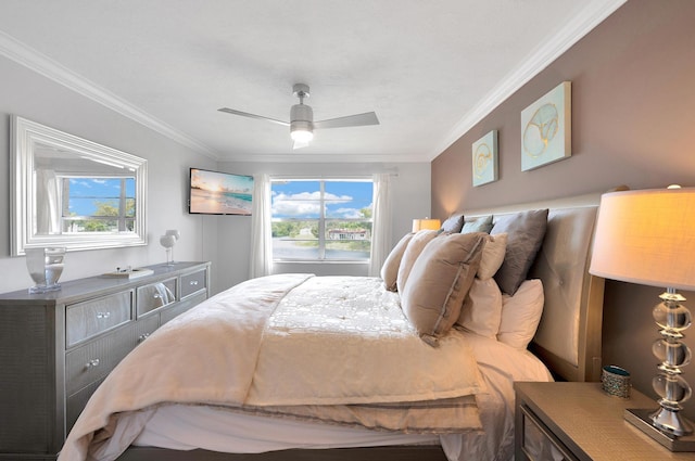 bedroom with a ceiling fan, ornamental molding, and multiple windows