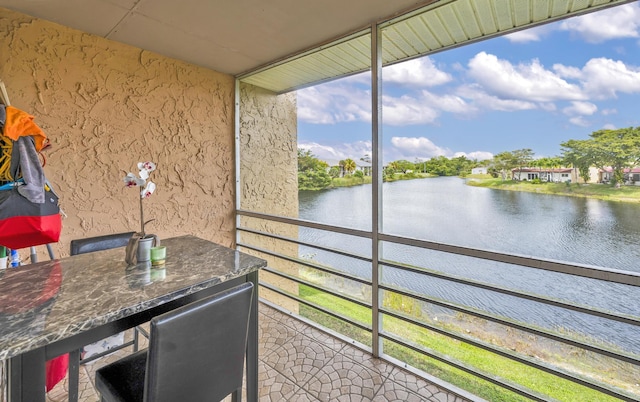 sunroom with a water view