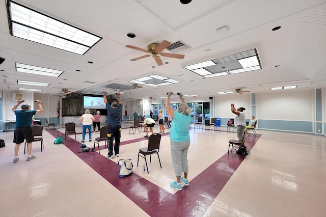 interior space featuring tile patterned floors, a ceiling fan, and visible vents
