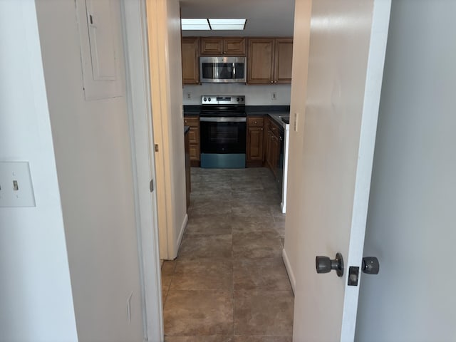 hallway featuring baseboards