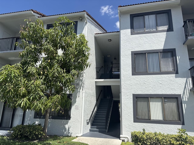 view of property featuring stairway