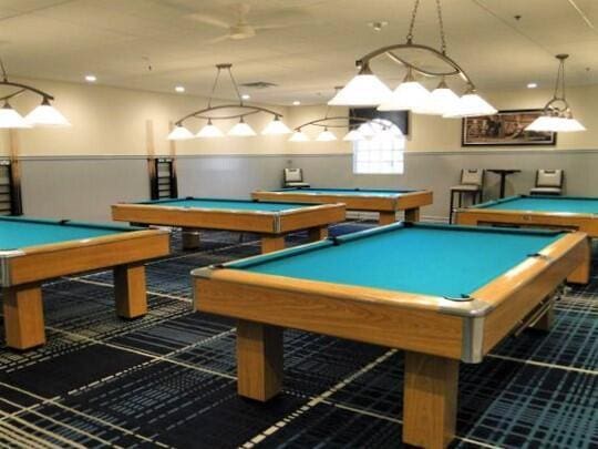 game room with wainscoting and pool table