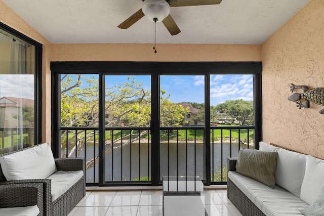 sunroom with outdoor lounge area and ceiling fan