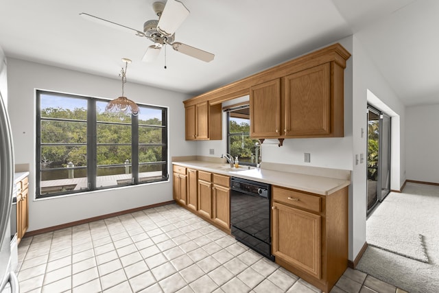 kitchen with black dishwasher, a ceiling fan, a healthy amount of sunlight, and light countertops
