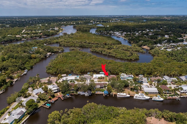 drone / aerial view featuring a water view and a residential view
