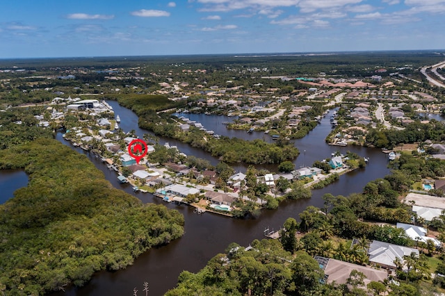 birds eye view of property with a water view and a residential view
