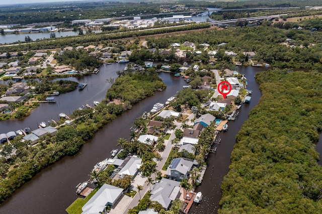 birds eye view of property featuring a water view and a residential view
