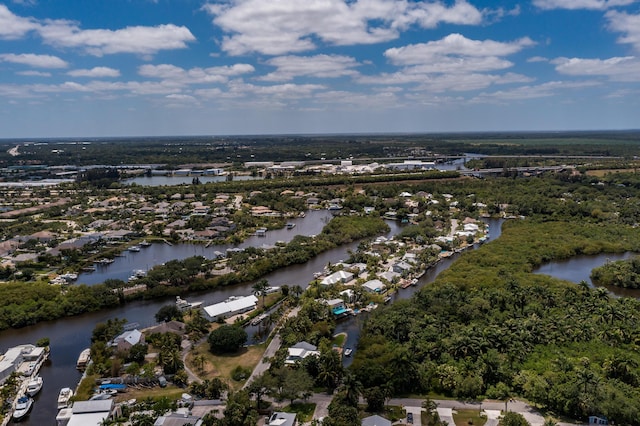 birds eye view of property featuring a water view and a residential view