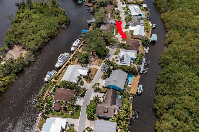drone / aerial view with a residential view and a water view