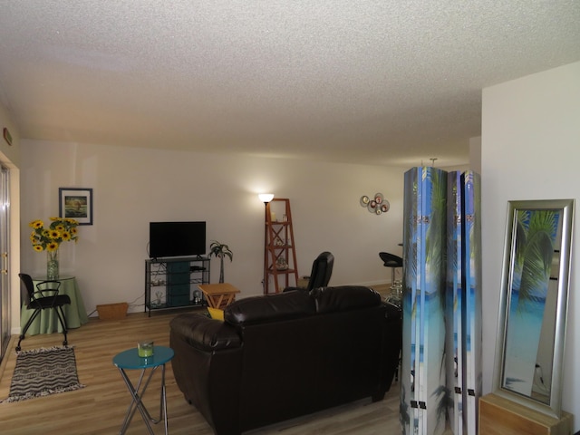 701 Lori Dr Unit 103, Palm Springs, FL 33461 - living room featuring a textured ceiling and wood finished floors