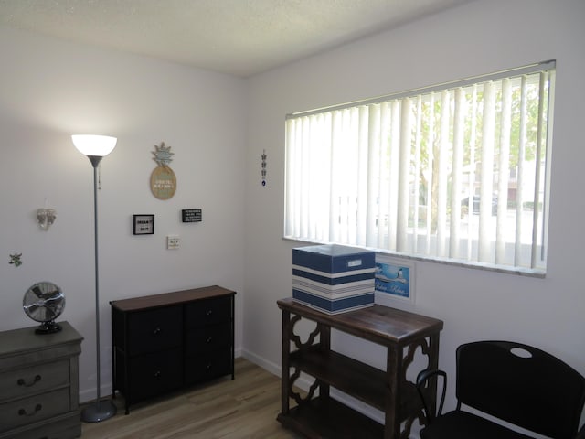 701 Lori Dr Unit 103, Palm Springs, FL 33461 - sitting room with light wood-style floors and baseboards