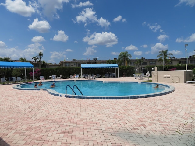 701 Lori Dr Unit 103, Palm Springs, FL 33461 - community pool with a patio and fence