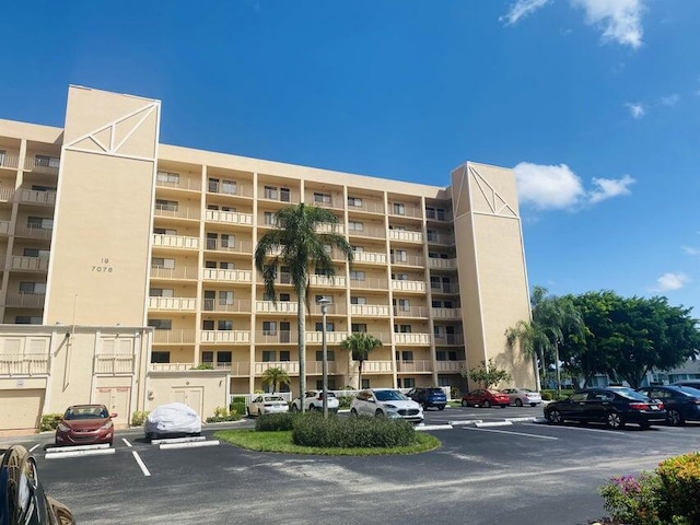 7076 Huntington Ln Unit 208, Delray Beach, FL 33446 - view of apartment building / complex with uncovered parking
