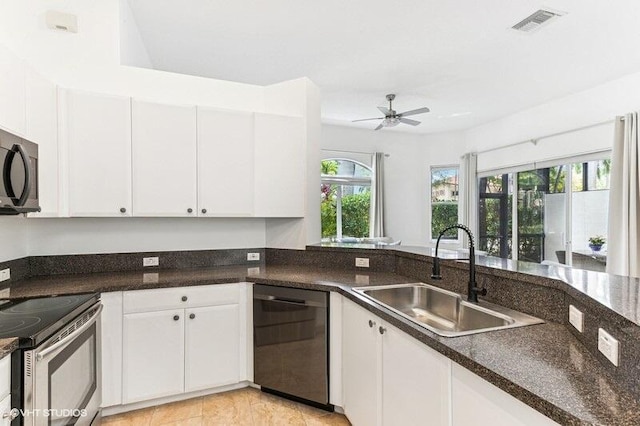 kitchen with a ceiling fan, stainless steel electric range oven, dishwasher, a sink, and white cabinets