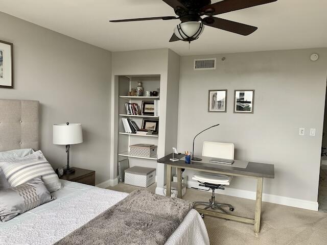 6562 Boca Del Mar Dr Unit 527, Boca Raton, FL 33433 - bedroom featuring carpet flooring, baseboards, and a desk