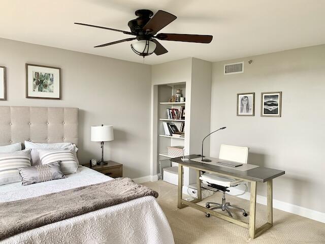 6562 Boca Del Mar Dr Unit 527, Boca Raton, FL 33433 - carpeted bedroom featuring baseboards, a desk, and ceiling fan