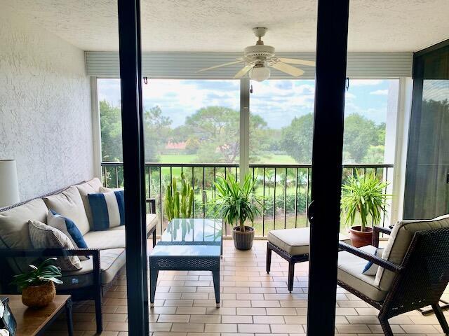 6562 Boca Del Mar Dr Unit 527, Boca Raton, FL 33433 - sunroom / solarium featuring a textured wall and a textured ceiling