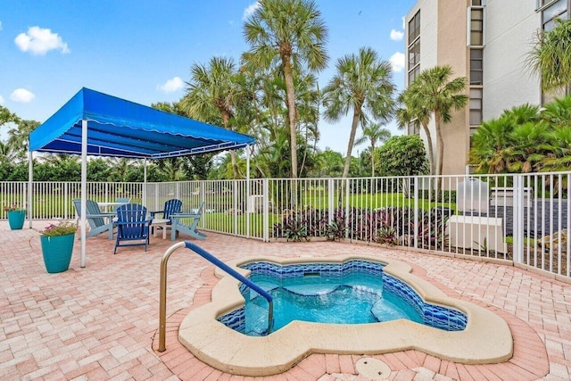 6562 Boca Del Mar Dr Unit 527, Boca Raton, FL 33433 - view of pool featuring a patio area, fence, and a hot tub