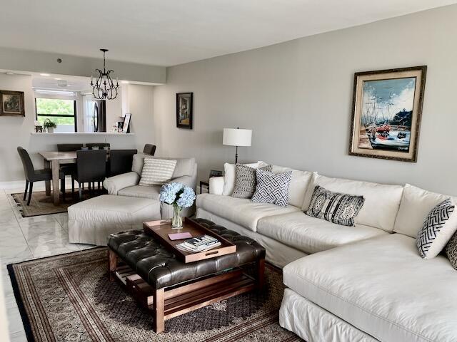 6562 Boca Del Mar Dr Unit 527, Boca Raton, FL 33433 - living area with marble look tile flooring and a chandelier