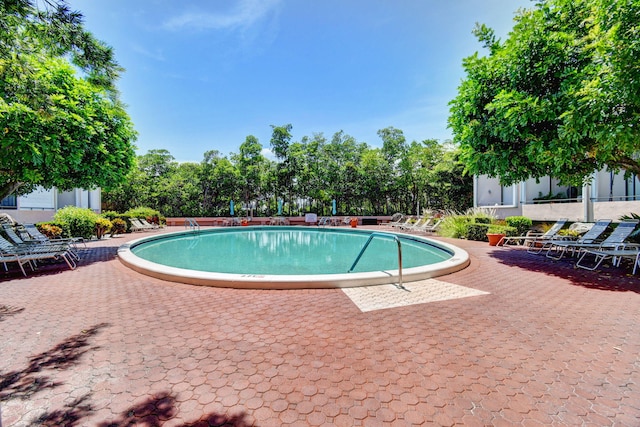 3589 S Ocean Blvd Unit 509, South Palm Beach, FL 33480 - community pool featuring a patio area