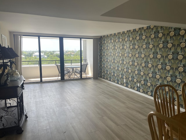 3589 S Ocean Blvd Unit 509, South Palm Beach, FL 33480 - living room with wood finished floors and baseboards